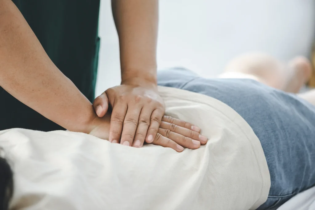 Hands-on chiropractic adjustment of the spine in Dumont