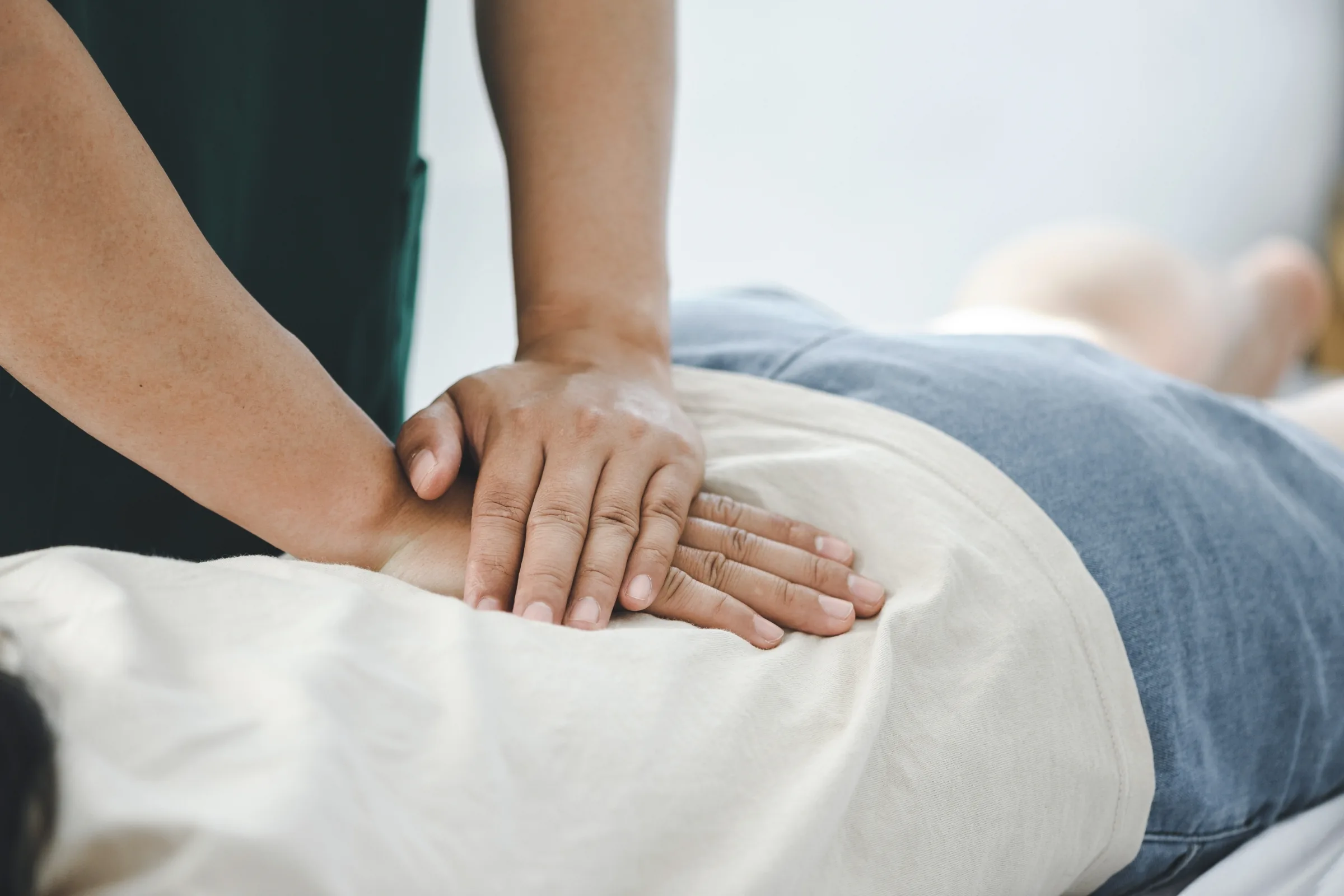 Hands-on chiropractic adjustment of the spine in Dumont